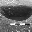 Excavation photograph : trench II - posthole fBAX, half section, facing north.