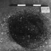 Excavation photograph : trench II - posthole BAZ, half section from above, facing west.