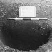 Excavation photograph : trench II - fBBD, posthole half section, facing north.