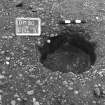 Excavation photograph : trench II - posthole BBG, excavated, facing south.