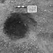 Excavation photograph : trench II - posthole BBM, excavated, facing west.