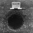 Excavation photograph : trench II - posthole BBs, excavated, from above, facing east.