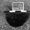 Excavation photograph : trench II - posthole BBW, half section, facing east.