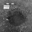 Excavation photograph : trench II - posthole BBZ, partly excavated, from above, facing north.