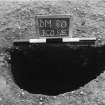 Excavation photograph : trench II - posthole BCO, half section, facing south-east.