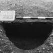 Excavation photograph : trench II - posthole BCU, half section, facing north-east.