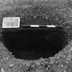 Excavation photograph : trench II - posthole BCV, half section, facing south-east.