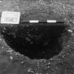 Excavation photograph : trench II -posthole BCZ, half section, facing north-west.