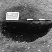 Excavation photograph : trench II -posthole BDD, half section, facing south-east.
