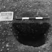 Excavation photograph : trench II - posthole BDV, half section, facing north.