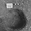 Excavation photograph : trench II - posthole BEH, excavated, from above, facing west.