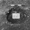 Excavation photograph : trench II - posthole BEN, partly excavated (?) facing east.