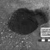 Excavation photograph : trench II - posthole BBR, excavated, facing east.