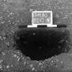 Excavation photograph : trench II - posthole BDO, half section, facing north-east.