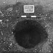 Excavation photograph : trench II - posthole BEG, excavated, facing north.