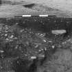 Excavation photograph : trench IV, feature DAH, eastern-most ring-ditch, cut II during excavation, showing features cut into lower fill.