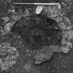 Excavation photograph : trench 1, close up of hearth f104, from N.