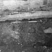 Excavation photograph : trench 3, showing concrete footings of modern wall and ? medieval wall f147 below, from W.