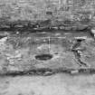 Excavation photograph : trench 2 - capstone of drain f185 removed, from N.