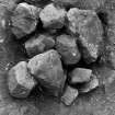 Excavation photograph : stone filled feature cutting robbed wall f161, from N.