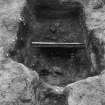 Excavation photograph : section across pit f166, from N.