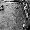 Excavation photograph : E end of metalling f507, from W.