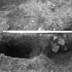 Excavation photograph : section across pits f648 and 651, from N.