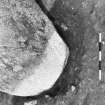 Excavation photograph. Site I, base of stone 7 from NW, showing hole cut into layer 4.