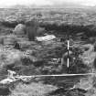 Excavation photograph. Stone 6 with poles fallen. Stone 5 behind and 4 beyond.