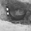 Excavation photograph.  F13, pot exposed from east.