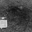 Excavation photograph.  F108 from south, as found.  Not previously excavated. Posthole.