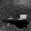 Excavation photograph.  F109 half sectioned, west side removed, from west.