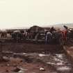 Excavation photograph. Cleaning up after torrential rain.