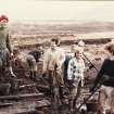 Excavation photograph. Cleaning up after torrential rain.