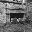 Excavation archive: Fireplace in E wall of hall at first floor level. prior to rubble clearance. From W.