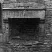 Excavation archive: Fireplace in S wall of tower at second floor level. From N.