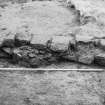 Excavation photograph : remains of east wall of gatehouse from east.