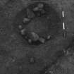 Excavation photograph : area 3 - f3028, pit intermediate oval, stone lining, from NW.