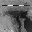 Excavation photograph : area 3 - f3164, natural fissure in pit edge, from S.