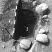 Excavation photograph : area 3 - f3020, late intrusion with charcoal spread in situ, from W.