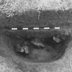 Excavation photograph : area 3 - f3154, tumbled stone in upper charcoal rich layer, from SE.