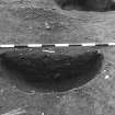 Excavation photograph : area 3 - f3134, half section, intrusive feature, from N.