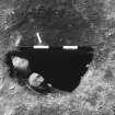 Excavation photograph : area 4 - f4024, post hole, half sectioned, with packing, from above.