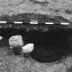 Excavation photograph : area 4 - f4087/4122 double feature revealed after fill A removed.