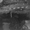 Excavation photograph : area F - W facing half section, through sub layers in E end of entrance chamber.
