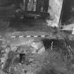 Excavation photograph ; area G - W facing mortar blocking to passageway.