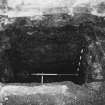 Excavation photograph : area K - trial hole in detention cell against south wall.