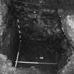 Excavation photograph : area K - trial hole in detention cell against south wall.