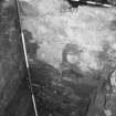 Excavation photograph : area K - wall exposed down to mortar spread at foot.