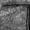 Excavation photograph : area N - stone and mortar spread 907.